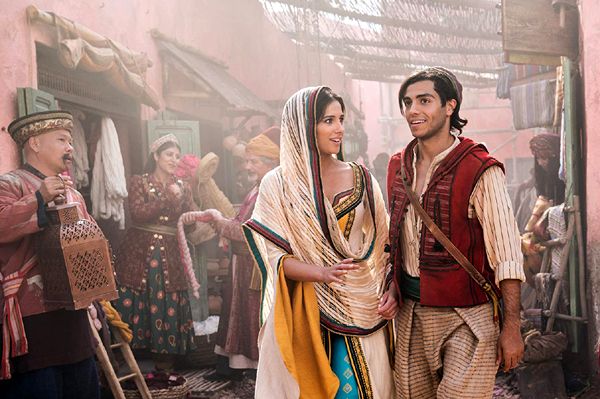 Aladdin (Mena Massoud) and Jasmine (Naomi Scott) meet on the streets of Agrabah in Guy Ritchie's live-action remake of Disney's ALADDIN.