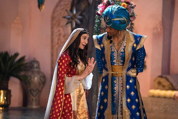Dalia (Nasim Pedrad) confers with the Genie (Will Smith), who's disguised as a mariner in ALADDIN.