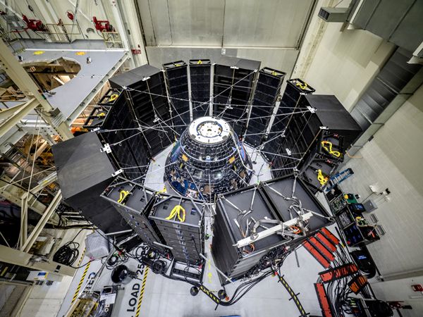 The Orion capsule that will fly on Exploration Mission-1 undergoes acoustics testing at NASA's Kennedy Space Center in Florida.