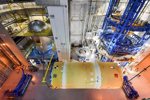 The forward join for the SLS rocket is now in horizontal position at NASA's Michoud Assembly Faciliy in New Orleans, Louisiana...in preparation for its mate to the SLS' liquid hydrogen tank.