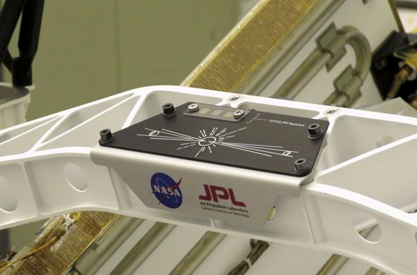 A placard containing three microchips bearing the names of 10.9 million people is attached to the Perseverance Mars rover at NASA's Kennedy Space Center in Florida.