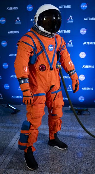 The prototype of the Orion Crew Survival System spacesuit on display at a NASA event.