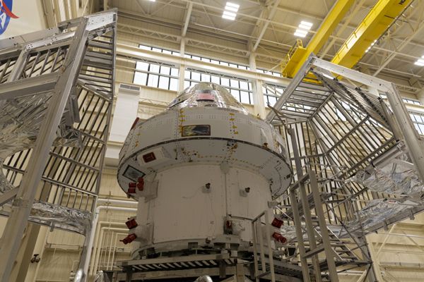 The Orion spacecraft and its European Service Module is about to be placed inside a cage prior to undergoing now-completed multi-month tests at NASA's Plum Brook Station in Sandusky, Ohio.