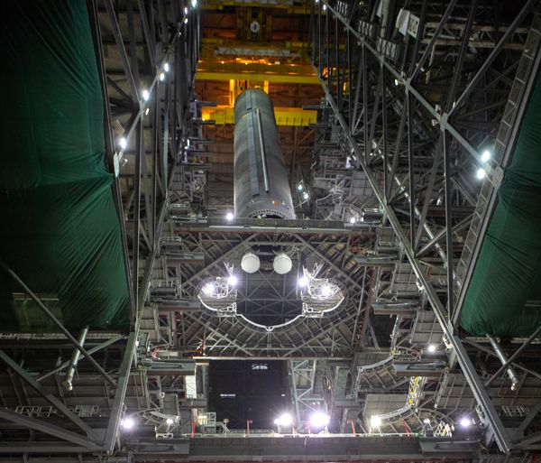 The Space Launch System's core stage pathfinder is lowered into High Bay 3 inside the Vehicle Assembly Building at NASA's Kennedy Space Center in Florida...on October 16, 2019.