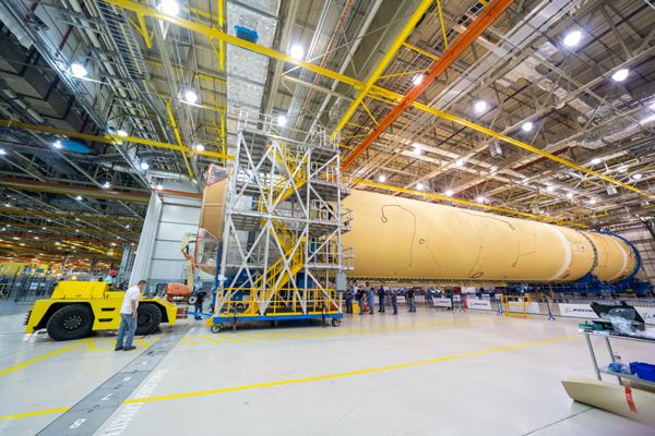 Engineers at NASA's Michoud Assembly Facility in New Orleans, Louisiana attach the engine section to the rest of the Space Launch System's core stage booster...on September 19, 2019.