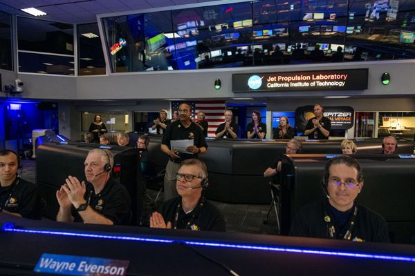 Inside the Space Flight Operations Facility at NASA's Jet Propulsion Laboratory near Pasadena, California, project members applaud after the mission came to an end on January 30, 2020.