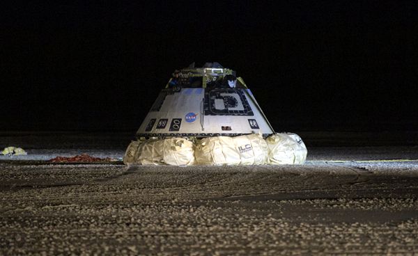 The Starliner capsule rests on its airbags after landing at White Sands Space Harbor in New Mexico...on December 22, 2019.
