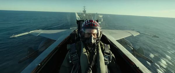 An F/A-18 Hornet piloted by Maverick (Tom Cruise) catapults off an aircraft carrier in TOP GUN: MAVERICK.