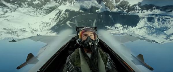 Maverick flies above a snow-covered mountain range in TOP GUN: MAVERICK.