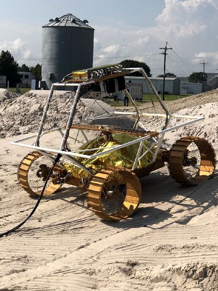 An engineering model of the VIPER lunar rover rolls along a testbed at NASA's Johnson Space Center in Houston, Texas.