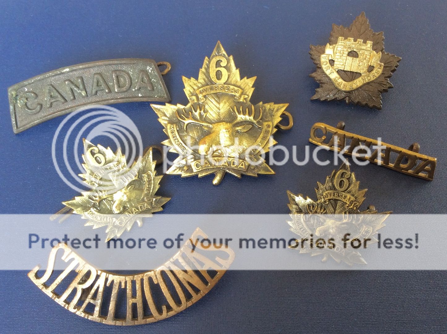 A few medals and a couple of badges... F0B4697A-5B23-4309-A888-BDC71FDD2FA7_zpsca8frnx5