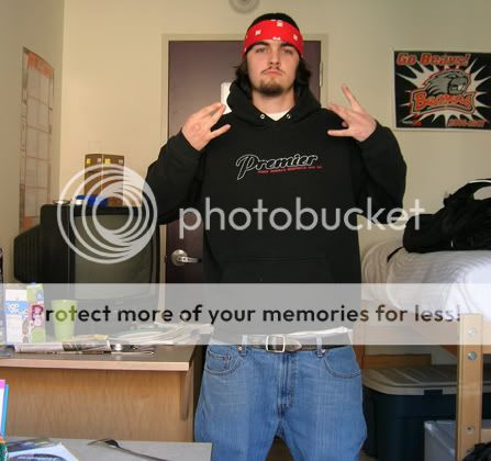 Male with red bandana shwoing NW signs with fingers